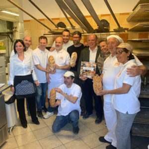 Delivery of certificate of merit to local bakers in Alba Italy