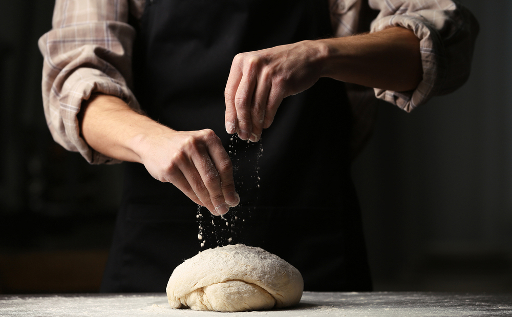 Hands that flour the dough